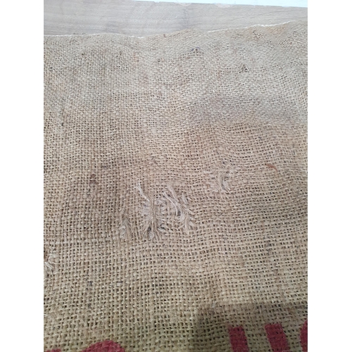 30 - Five hessian Sacks with various advertising logos (some repairs).