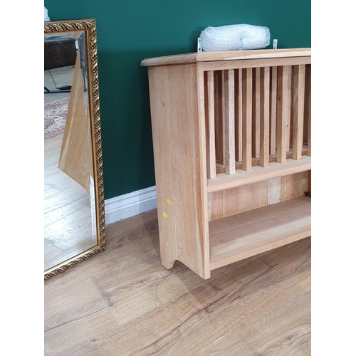 33 - A modern oak Plate Rack and a gilt framed Wall Mirror