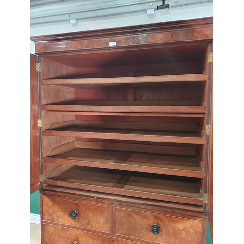 41 - A 19th Century flamed mahogany Linen Press, the cornice above pair of panelled doors enclosing five ... 