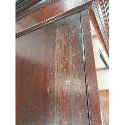 41 - A 19th Century flamed mahogany Linen Press, the cornice above pair of panelled doors enclosing five ... 