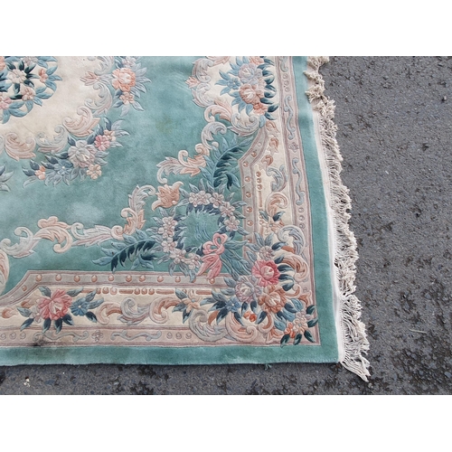 460 - A blue ground Rug with floral border and central floral motif, 10ft 10