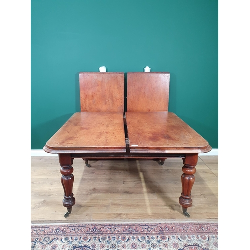 462 - A Victorian mahogany rectangular Extending Dining Table, two spare leaves, on turned and fluted supp... 