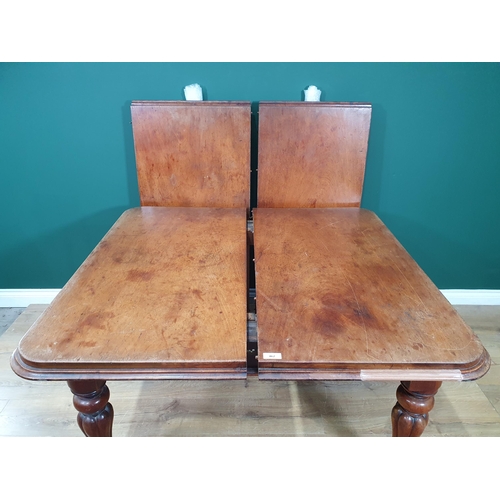 462 - A Victorian mahogany rectangular Extending Dining Table, two spare leaves, on turned and fluted supp... 