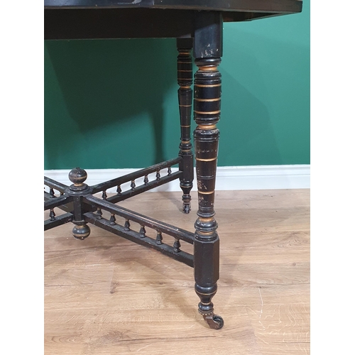 466 - An ebonised, gilt decorated Octagonal Occasional Table on turned supports and castors, 42