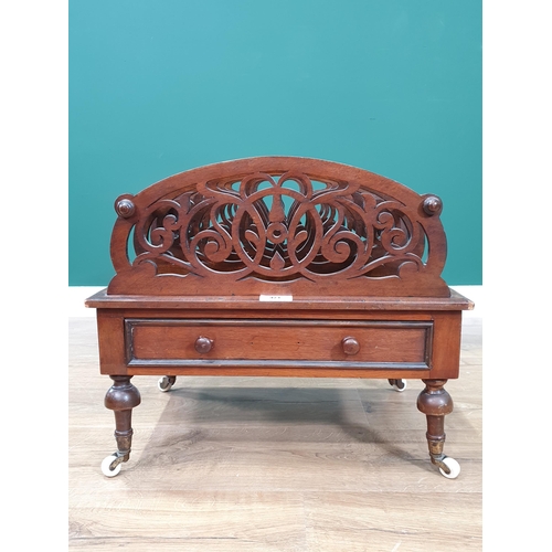 471 - A shaped and pierced mahogany Canterbury with single fitted drawer on turned supports and castors, 2... 