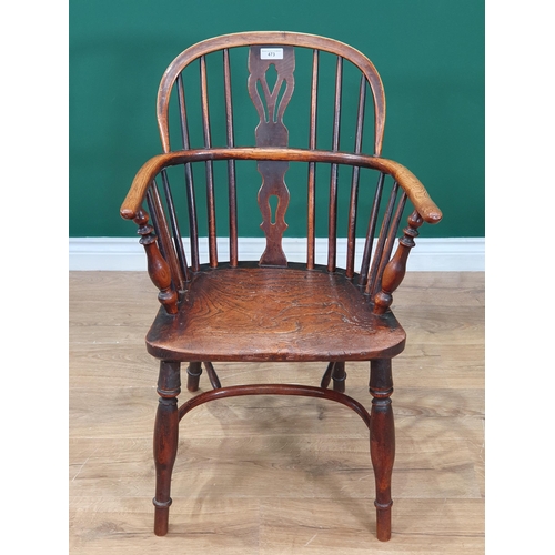 473 - A 19th Century ash and elm Windsor Elbow Chair with pierced splat back, turned supports and crinolin... 