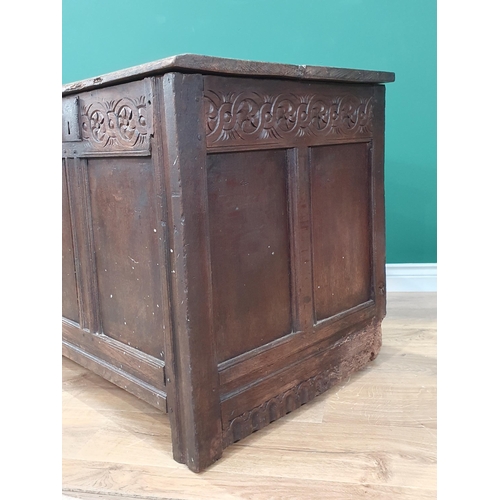 495 - An antique oak panelled Coffer with carved frieze, 3ft 9