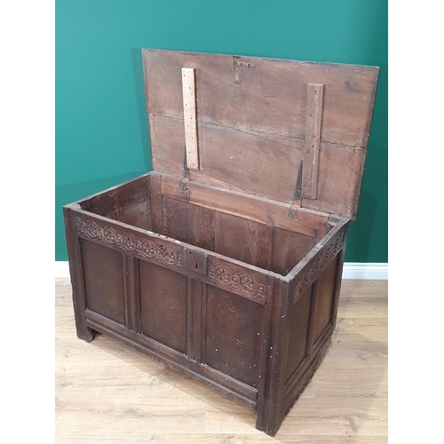 495 - An antique oak panelled Coffer with carved frieze, 3ft 9