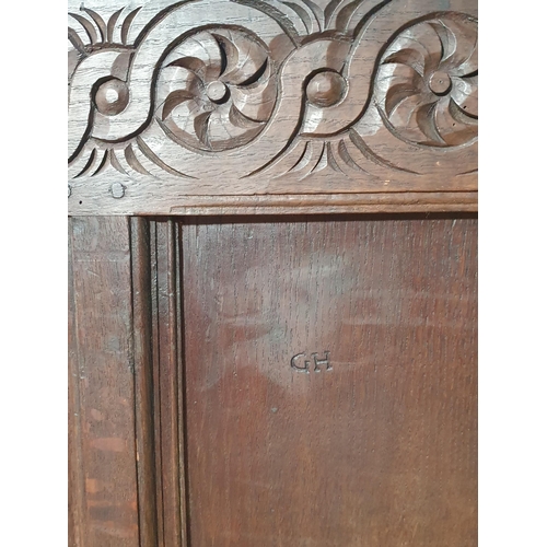 495 - An antique oak panelled Coffer with carved frieze, 3ft 9