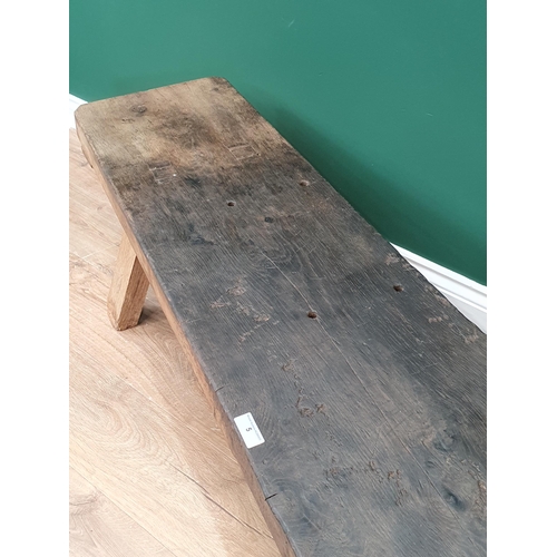 5 - An old oak Pig Bench with single plank top on square supports, 5ft 8