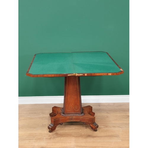 505 - A 19th Century rosewood and brass inlaid Fold over Card Table on beaded pedestal support and quadrup... 