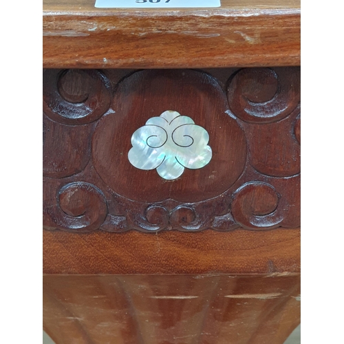 507 - A mahogany reproduction two tier Centre Table with inlaid mother of pearl decorations, on four flute... 