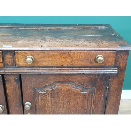 516 - An 18th Century oak Dresser Base fitted two drawers above pair of shaped paneled doors, 4ft 5in Wide... 