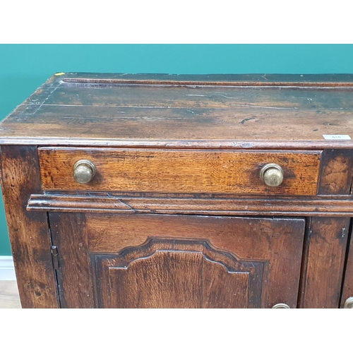 516 - An 18th Century oak Dresser Base fitted two drawers above pair of shaped paneled doors, 4ft 5in Wide... 