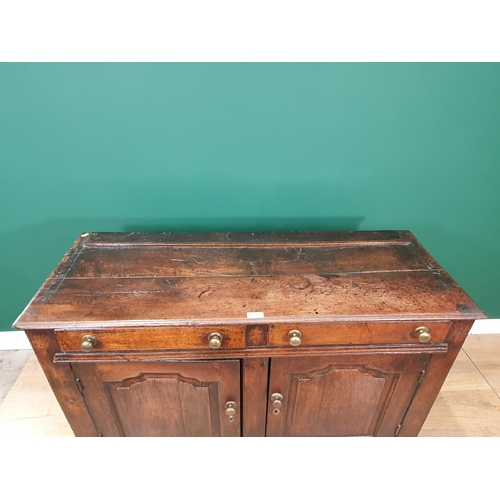 516 - An 18th Century oak Dresser Base fitted two drawers above pair of shaped paneled doors, 4ft 5in Wide... 