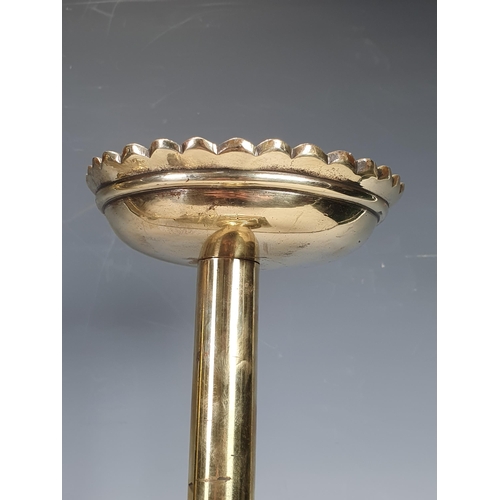 527 - A brass Pestle and Mortar with figurehead handles and mask and swag decorations, and a pair of brass... 