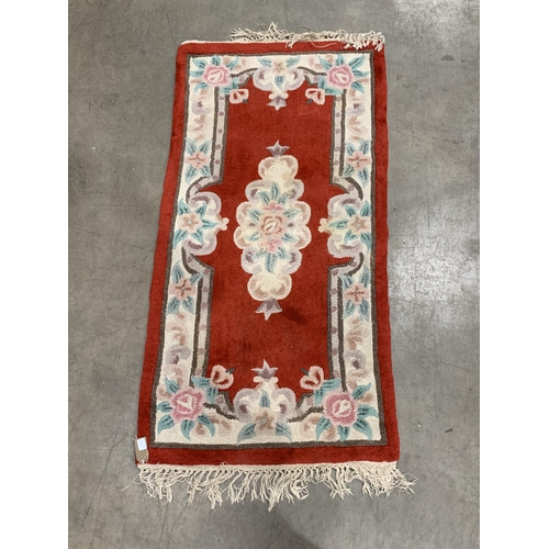 543 - A Pakistan Bokhara Rug with three rows of medallions on a red and maroon ground, 6ft x 4ft 6ft x 4ft... 