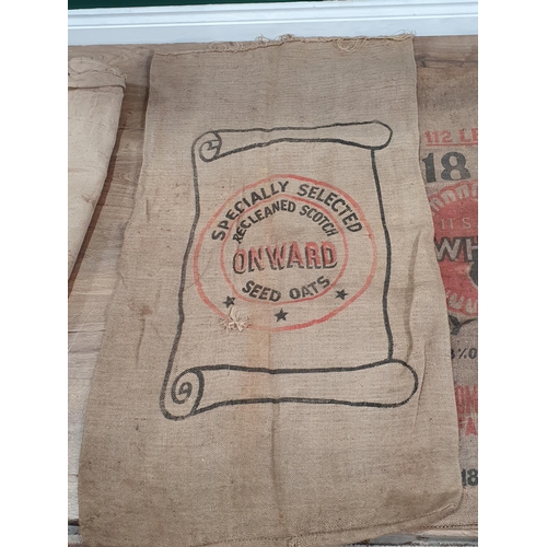 546 - Five hessian Sacks with various advertising logos (some repairs).