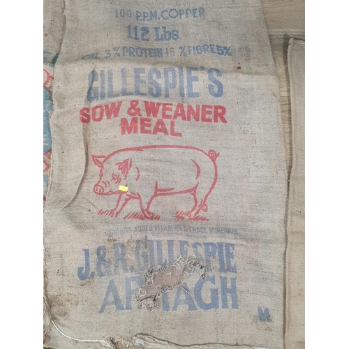 547 - Five hessian Sacks with various advertising logos (some repairs).