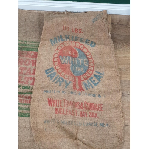 547 - Five hessian Sacks with various advertising logos (some repairs).