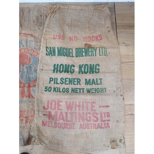 550 - Five hessian Sacks with various advertising logos (some repairs).