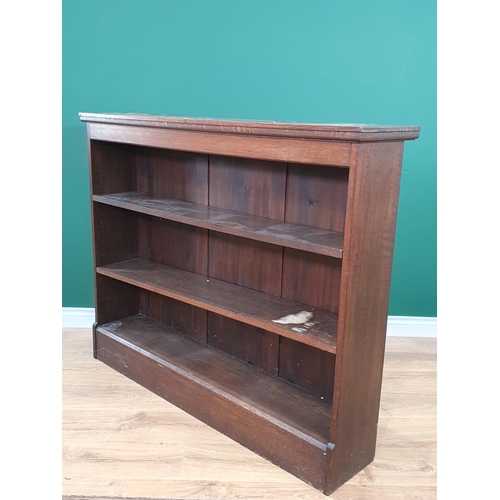 559 - An oak open Bookcase on plinth base 4ft 3in W x 3ft 6in H