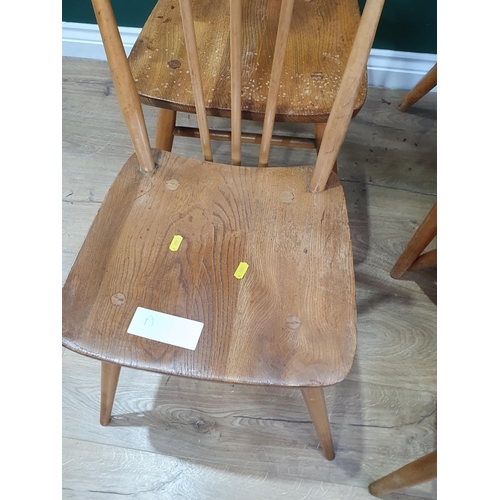 572 - A set of four Ercol stick back Chairs, and a set of four unmarked stick Back Chairs.