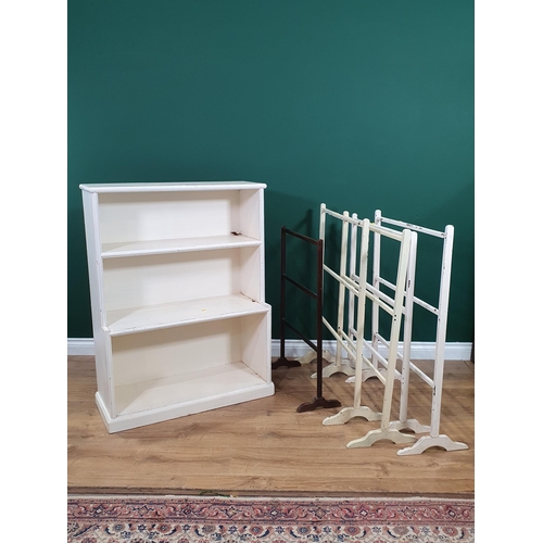 590 - A white painted open Bookcase on plinth base, 2ft 7