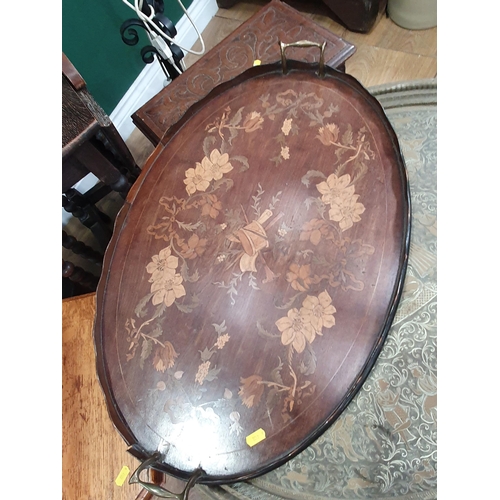 607 - An Eastern brass Tray top Table, a mahogany Cake Stand A/F,  an oval floral inlaid Tray, two Standar... 