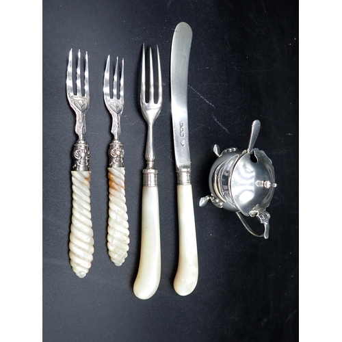 72 - Three Forks and a Knife with silver blade and mother of pearl hafts, and a silver Mustard Pot on hoo... 