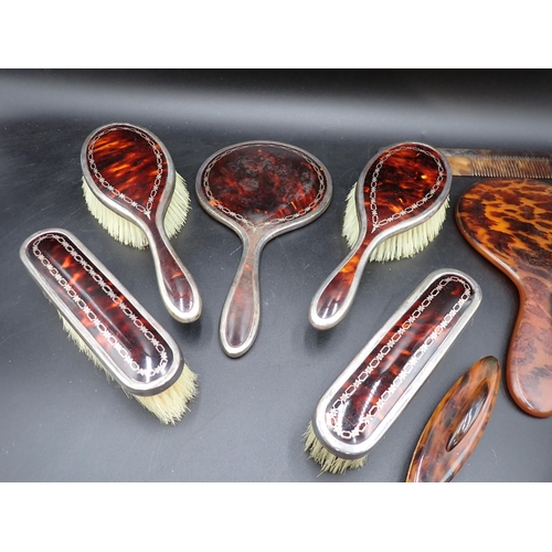 73 - A George V silver mounted tortoiseshell five piece Dressing Table Set, London 1927, and four other i... 