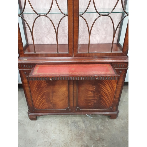 253 - A reproduction mahogany glazed Display Cabinet, the base fitted a pair of cupboard doors, 7ft H