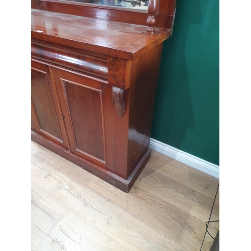 254 - A Victorian mahogany Chiffonier with raised back, fitted cushion drawer above a pair of cupboard doo... 