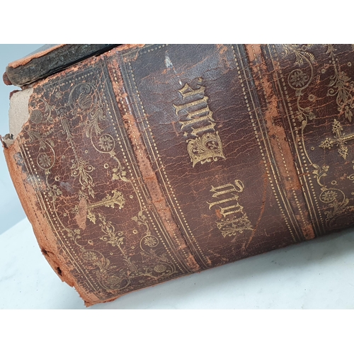 267 - Two leather bound Bibles and a leather bound volume of 