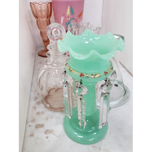 322 - A quantity of glassware including a large pink glass Jar and Cover, a green glass Table Lustre, a Va... 