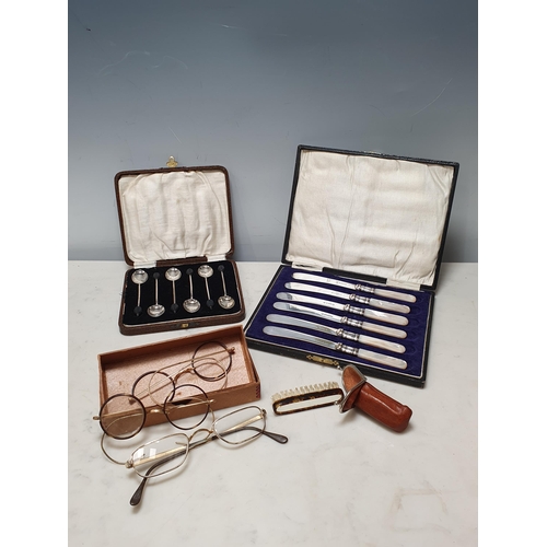 822 - A cased set of silver Coffee Spoons, plated Fruit Spoons with mother of pearl handles, three pairs o... 