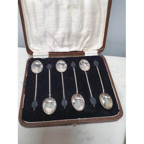 822 - A cased set of silver Coffee Spoons, plated Fruit Spoons with mother of pearl handles, three pairs o... 