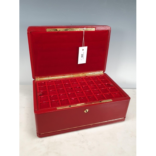 249 - A red leather Coin Collectors Case with padded lid, fall front, enclosing six lift out storage trays... 