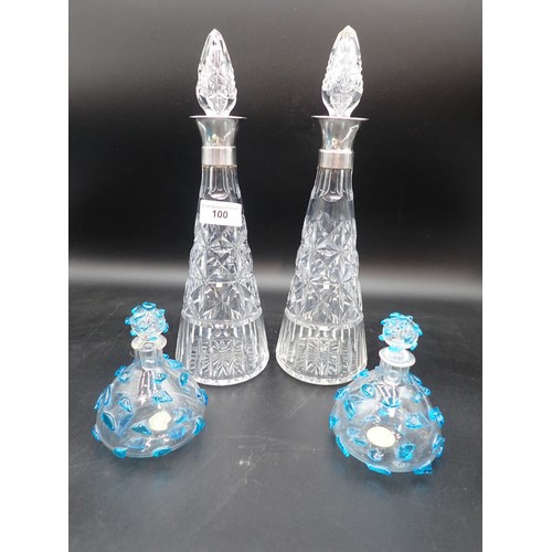 100 - A pair of George VI silver mounted glass Decanters and Stoppers, Birmingham 1948, one repaired and a... 