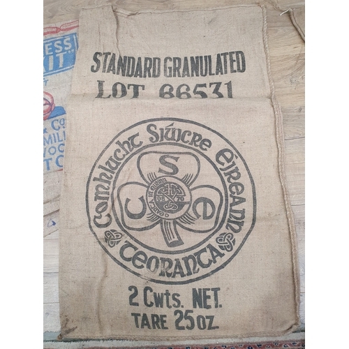 286 - Five hessian Sacks with various advertising logos (some repairs).