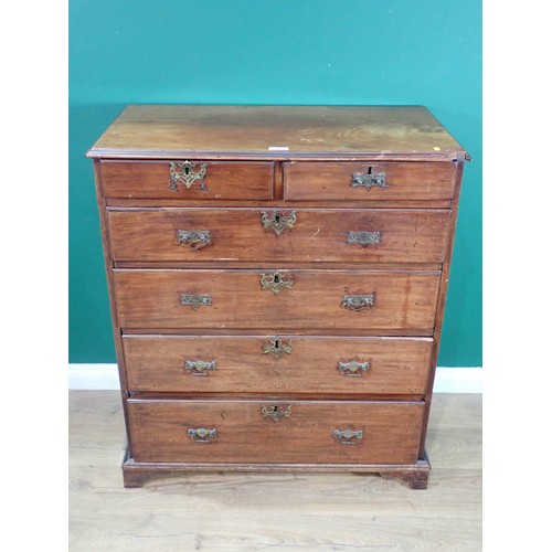 561 - A Georgian mahogany Chest of two short and four graduated long drawers mounted on ogee bracket feet ... 