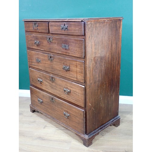 561 - A Georgian mahogany Chest of two short and four graduated long drawers mounted on ogee bracket feet ... 