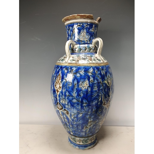 479 - A blue glazed ceramic four handled Vase with bands of floral decorations A/F 19