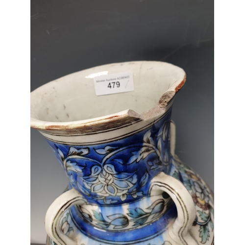 479 - A blue glazed ceramic four handled Vase with bands of floral decorations A/F 19