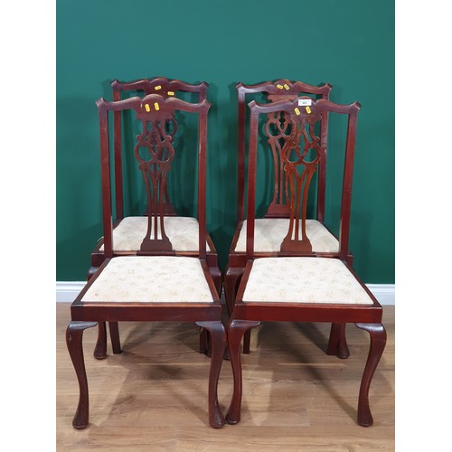 463 - A set of four mahogany splat back Dining Chairs with cream floral upholstered drop in seats. and ano... 