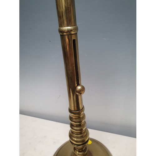 18 - A large antique brass Candlestick with slide ejector on circular base, 18in and a Bronze Mortar, 4in