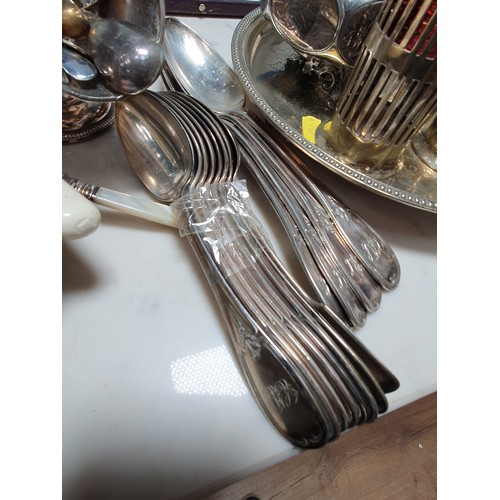 63 - A pair of Victorian silver mounted plated Fish Servers, in case, pair of plated Candlesticks, Salver... 