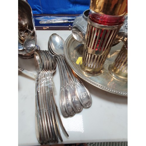 63 - A pair of Victorian silver mounted plated Fish Servers, in case, pair of plated Candlesticks, Salver... 