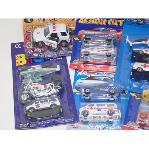 210 - Two boxes of Corgi, Chad Valley, Cararama and other Ambulance Models in card backed packaging