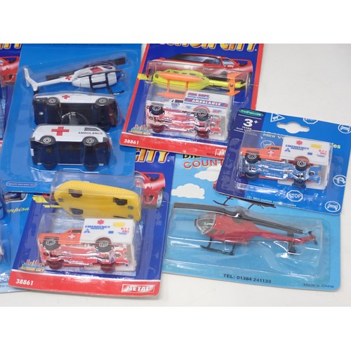 210 - Two boxes of Corgi, Chad Valley, Cararama and other Ambulance Models in card backed packaging